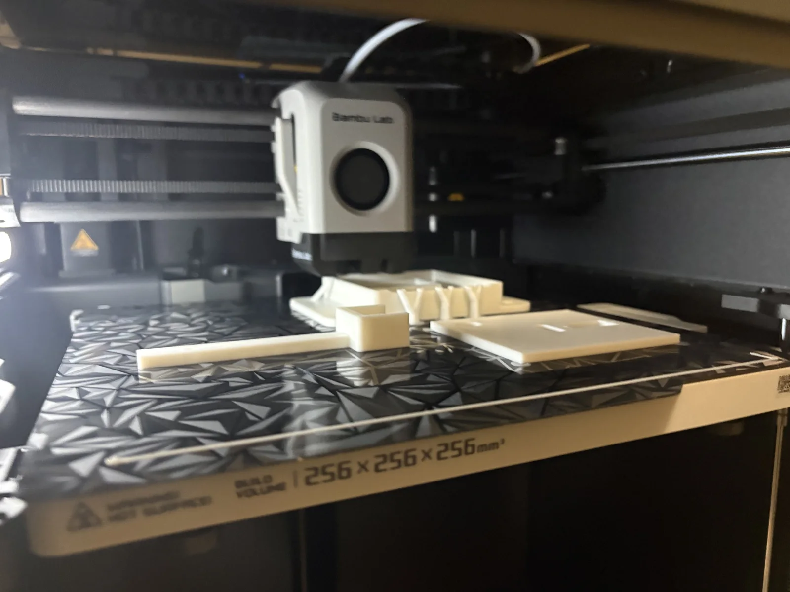 Test fitting the servo arm against the switch plate to find the right throw.
