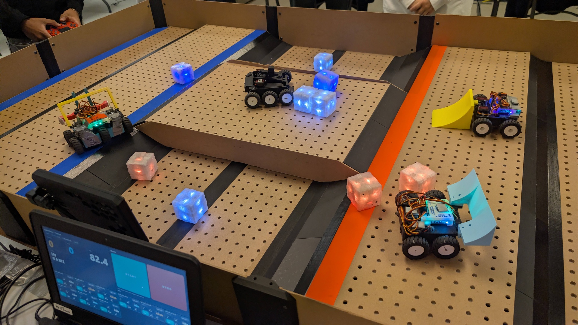 Cubic Chaos arena with competing MiniBots and glowing cubes